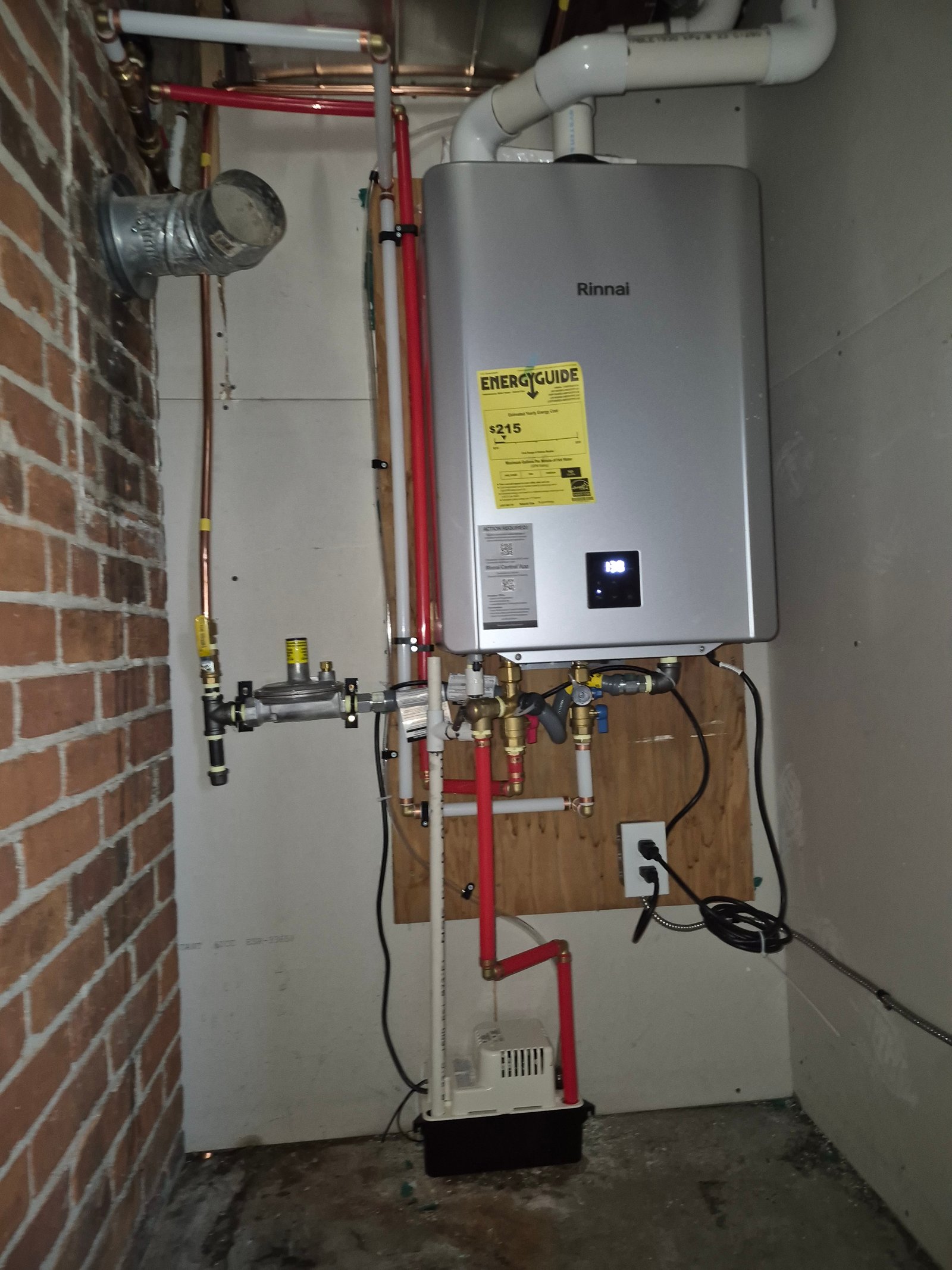 Rinnai tankless on-demand water heater installed in a mechanical closet