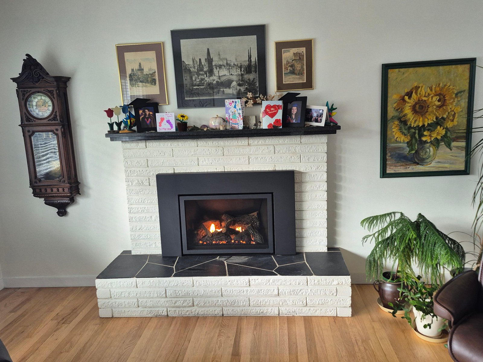 Gas fireplace insert in a white brick surround